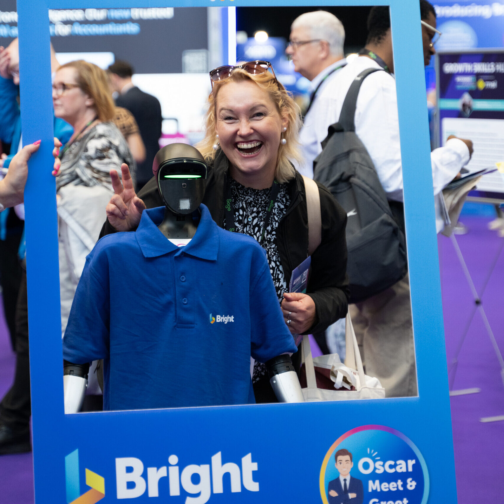 Bright robot and female posing for a photo