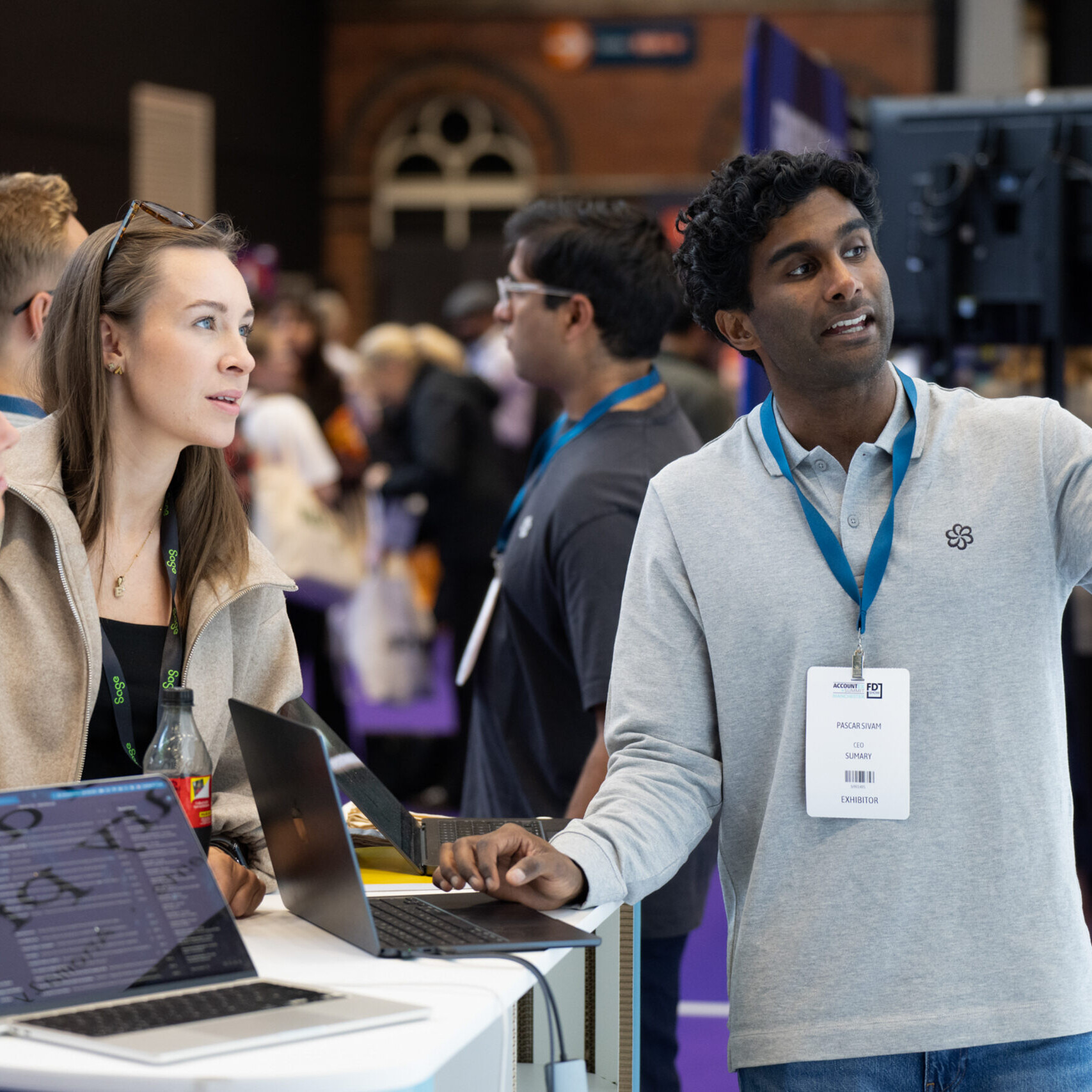 Visitor interacting with exhibitor