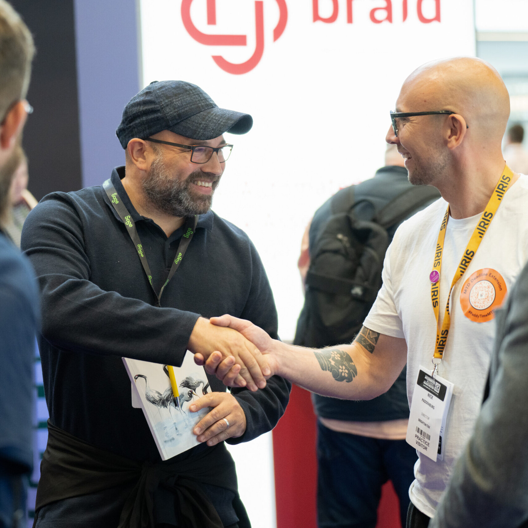 Visitor and Exhibitor shaking hands
