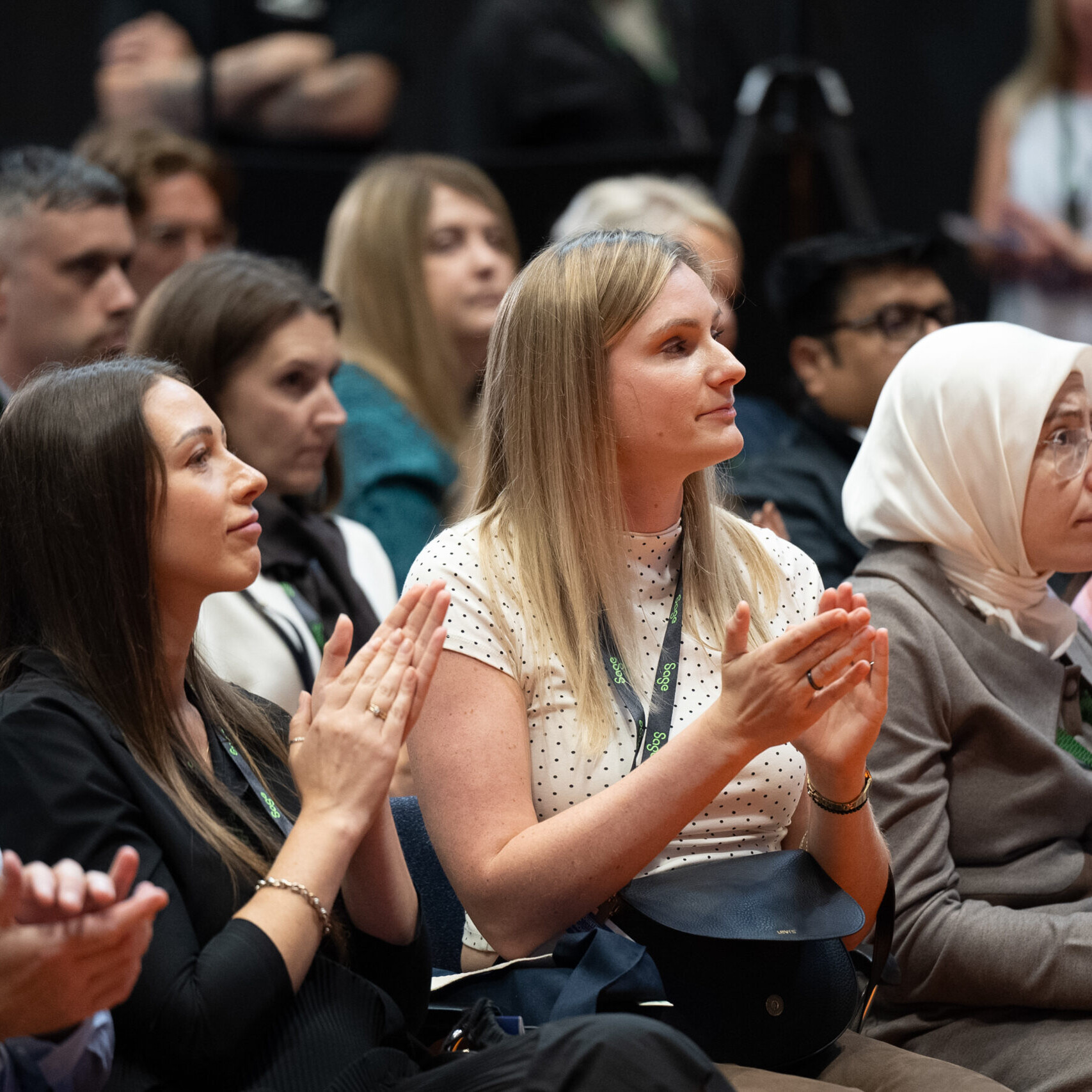 Visitors applauding a speaker at Accountex Manchester